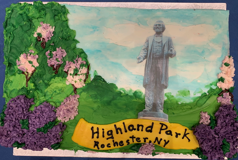 Portion of cake decorated with Frederick Douglass Statue in Highland Park, Rochester